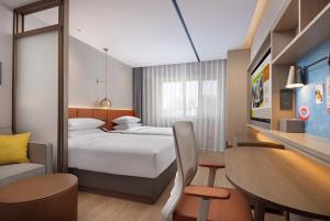 Postel nebo postele na pokoji v ubytování Home2 Suite by Hilton Harbin Central Street + 28 fotografií