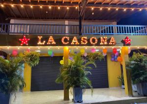 a sign that says la casino in front of a building at Habitación sencilla con desayuno - La Casona Hotel in La Pintada