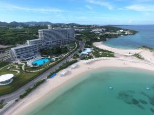 an aerial view of a resort and the beach at The Orion Hotel Motobu Resort & Spa in Motobu