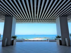 a view of the ocean from the top of a building at The Orion Hotel Motobu Resort & Spa in Motobu