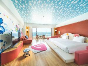 Ένα ή περισσότερα κρεβάτια σε δωμάτιο στο The Orion Hotel Motobu Resort & Spa