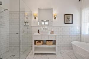 a white bathroom with a sink and a shower at Experience The Charm Of Little Plains Homestead in Gunnary +46 photos