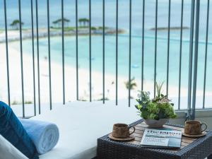 a view of the beach from a hotel room at The Orion Hotel Motobu Resort & Spa in Motobu