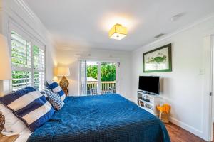 En eller flere senge i et værelse på Cabana Breeze + 32 billeder