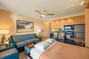 a room with a bed and a couch and a kitchen at Kuleana Club #510 - Ocean View -1 bedroom & 1 bathroom - 2nd Floor in Kahana