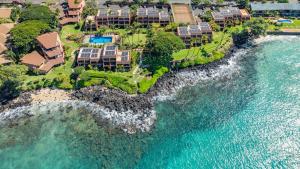 an aerial view of a resort next to the ocean at Kuleana Club #510 - Ocean View -1 bedroom & 1 bathroom - 2nd Floor in Kahana