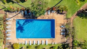 an overhead view of a large swimming pool at Kuleana Club #510 - Ocean View -1 bedroom & 1 bathroom - 2nd Floor in Kahana