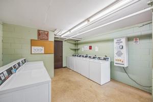 a room with a row of machines in a room at Kuleana Club #510 - Ocean View -1 bedroom & 1 bathroom - 2nd Floor in Kahana