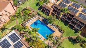 an overhead view of a swimming pool in front of a building at Kuleana Club #510 - Ocean View -1 bedroom & 1 bathroom - 2nd Floor in Kahana