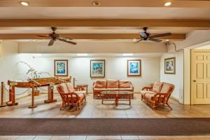 a living room with a ping pong table and chairs at Kuleana Club #510 - Ocean View -1 bedroom & 1 bathroom - 2nd Floor in Kahana
