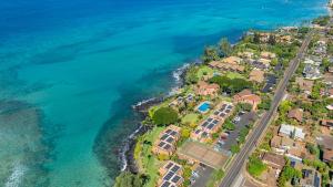 an aerial view of a resort next to the ocean at Kuleana Club #510 - Ocean View -1 bedroom & 1 bathroom - 2nd Floor in Kahana