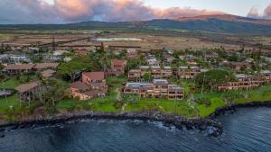an aerial view of a resort on the water at Kuleana Club #510 - Ocean View -1 bedroom & 1 bathroom - 2nd Floor in Kahana