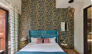 Ένα ή περισσότερα κρεβάτια σε δωμάτιο στο Casa Sahani 2 bhk near Baga
