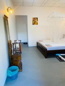Postel nebo postele na pokoji v ubytování Bloom Guest House