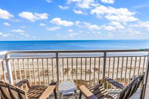 a balcony with a view of the beach at Atlantica Towers Beachfront Condo w Pools in Myrtle Beach +19 photos