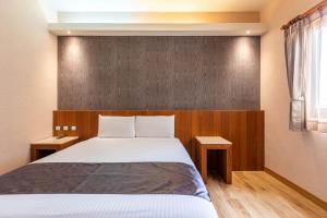 Voodi või voodid majutusasutuse Hualien Toongmao Resort toas