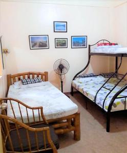 Ένα ή περισσότερα κρεβάτια σε δωμάτιο στο TAGAYTAY TOWNHOUSE for Daily Rent