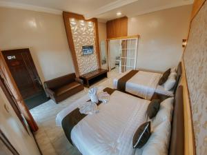 Postel nebo postele na pokoji v ubytování Parama Bromo Hotel