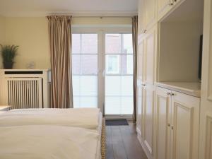 Ein Bett oder Betten in einem Zimmer der Unterkunft Kampstraße 9, W2, GB3