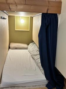 Postel nebo postele na pokoji v ubytování Hostel Furoya