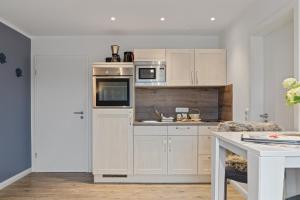 Η κουζίνα ή μικρή κουζίνα στο Appartementanlage am Strand Appartementanlage am Strand Kleines Versteck - 6
