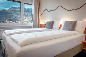 Voodi või voodid majutusasutuse Hotel Merkur - West Station toas