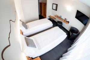 Voodi või voodid majutusasutuse Hotel Merkur - West Station toas