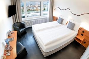 Voodi või voodid majutusasutuse Hotel Merkur - West Station toas