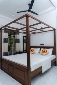 Ένα ή περισσότερα κρεβάτια σε δωμάτιο στο Blue Heaven Villa Ahangama