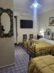 TV a/nebo společenská místnost v ubytování Maison Manni' B&B