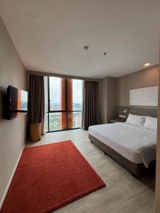 Postel nebo postele na pokoji v ubytování QQ Empire Damansara hotel room