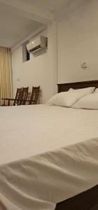 Letto o letti in una camera di VThree Family House