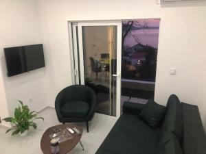TV a/nebo společenská místnost v ubytování De Lux Apartments Smolovic