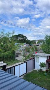 a view of a city from a balcony at Reymen's Transient in Bacolor