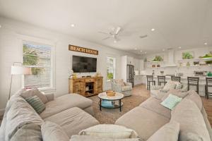 a living room with a couch and a table at Endless Summer in Anna Maria