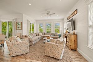 a living room with a couch and chairs at Endless Summer in Anna Maria