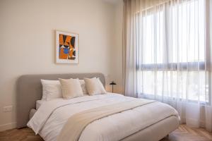 Ένα ή περισσότερα κρεβάτια σε δωμάτιο στο Interlace by Holistays