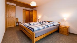 a bedroom with a large bed with pillows on it at Christiania in Riederalp
