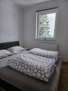 Postel nebo postele na pokoji v ubytování Apartman D&A + 4 fotografie
