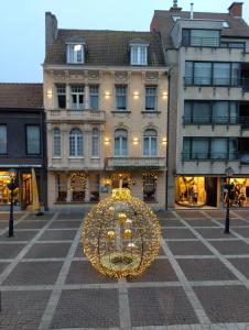 a large christmas light in front of a building at Residentie Canada in Blankenberge