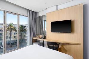 Télévision ou salle de divertissement dans l'établissement Rihab Hotel