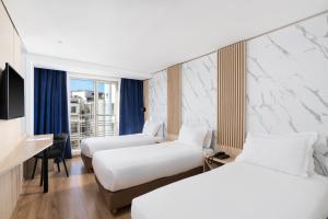 Un ou plusieurs lits dans un hébergement de l'établissement Rihab Hotel