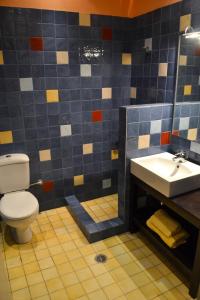 a bathroom with a toilet and a sink at The Grand Beach House in Karistos +31 photos