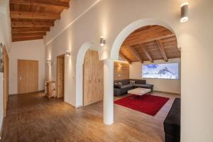 a living room with a couch and a table at Ferienlodge Alpenkönigin Vacation in Stubai Valley in Neustift im Stubaital