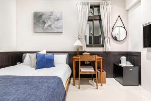 Ένα ή περισσότερα κρεβάτια σε δωμάτιο στο Jiufen Harmony Inn