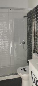 a bathroom with a toilet and a glass shower at Home2Book Stylish Studio Costa del Silencio in Costa Del Silencio