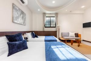 Ένα ή περισσότερα κρεβάτια σε δωμάτιο στο Jiufen Harmony Inn
