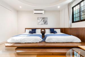 Ένα ή περισσότερα κρεβάτια σε δωμάτιο στο Jiufen Harmony Inn