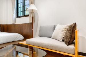 Ένα ή περισσότερα κρεβάτια σε δωμάτιο στο Jiufen Harmony Inn