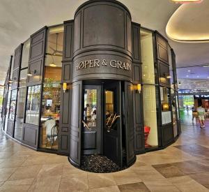 a store in a shopping mall with a sign on it at A Tower View Home in Sibu +39 photos
